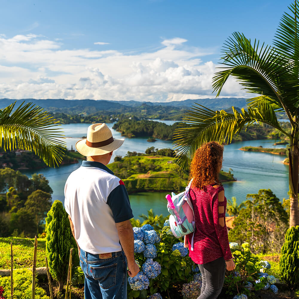 Tourists enjoying the view on the lake landscape of El Peñol in Antioquia